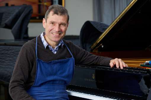 Ulrich Gerhartz working on a Steinway piano &copy; Toni Trasmundi
