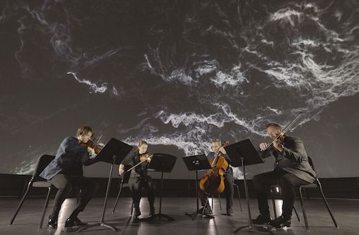 Spektral Quartet playing Anna Thorvaldsdottir's <i>Enigma</i> at Adler Planetarium © Daniel Kullman