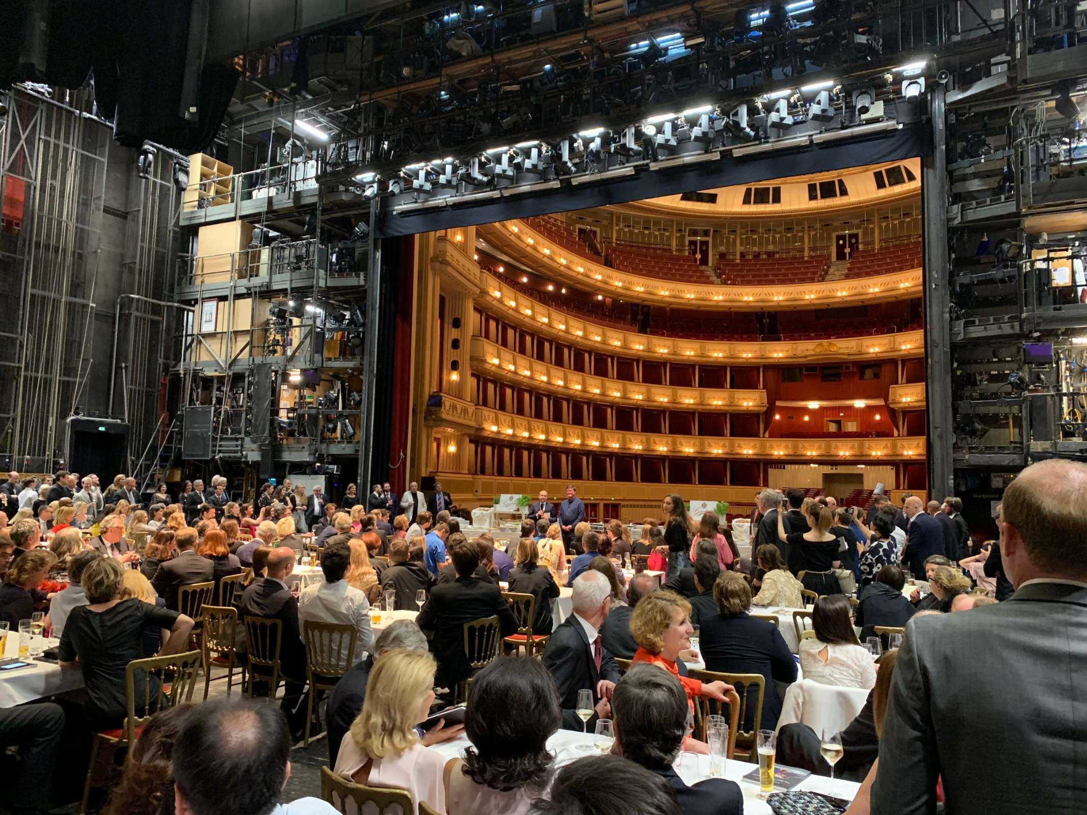 Have a sneak peek behind the curtain onto the stage of the Wiener Staatsoper on their 150th birthday &copy; David Karlin