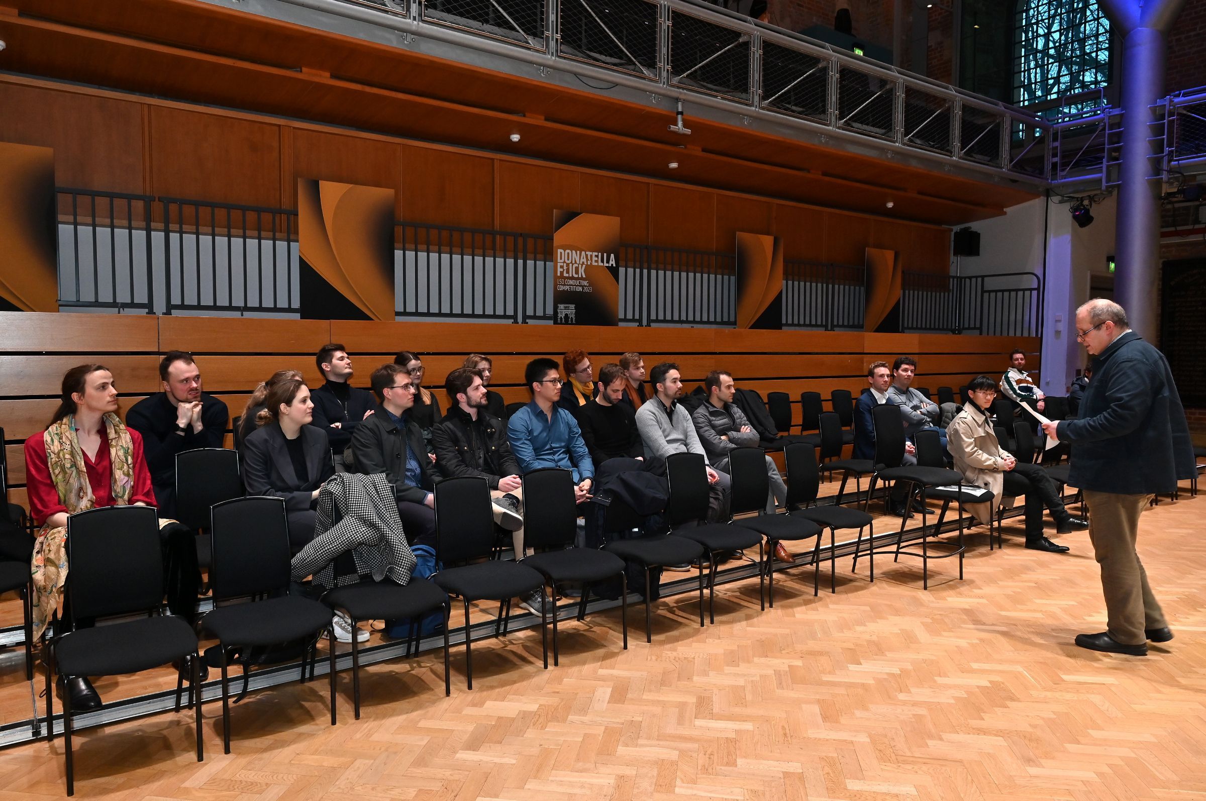 Panel chair David Alberman addresses the twenty participating conductors &copy; Mark Allan | LSO
