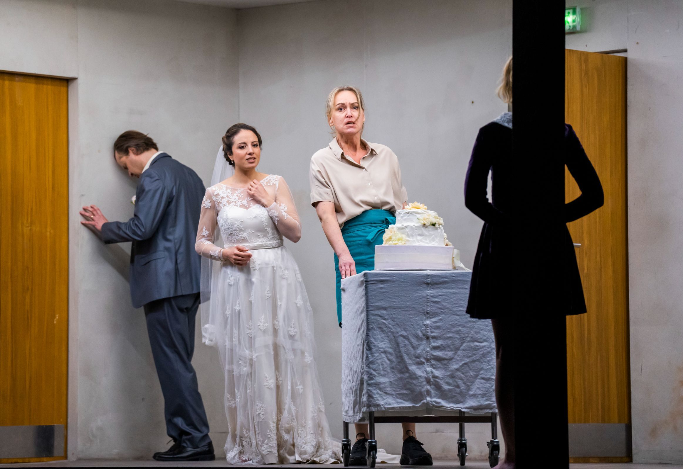 Markus Nykänen (Bridegroom), Lilian Farahani (Bride) and Jenny Carlstedt (Waitress) © ROH | Tristram Kenton