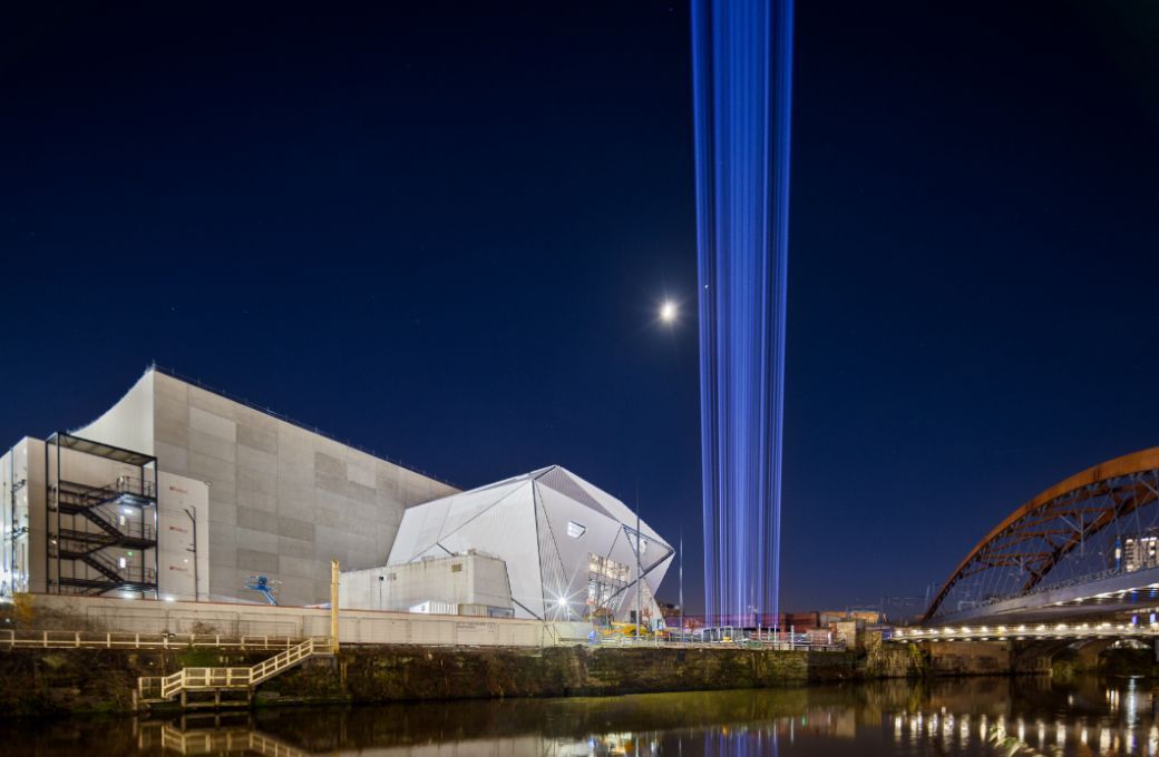 A beam of light is shot up to the sky in <i>First Breath</i> at Factory International, January 2023 © Tomasz Kozak
