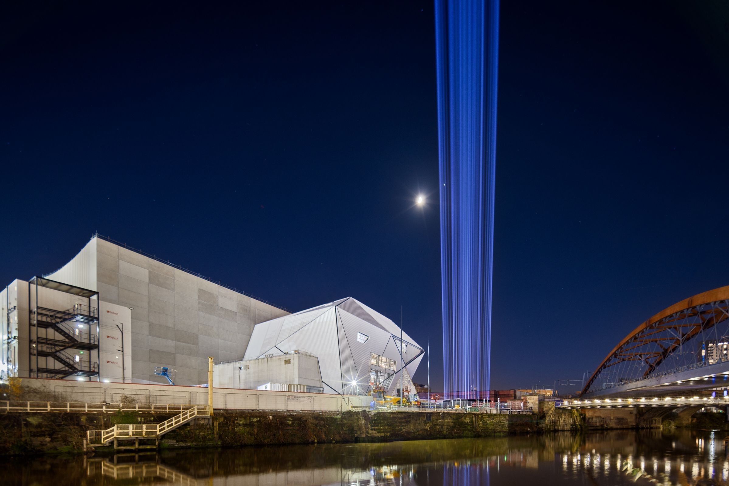 A beam of light is shot up to the sky in <i>First Breath</i> at Factory International, January 2023 © Tomasz Kozak