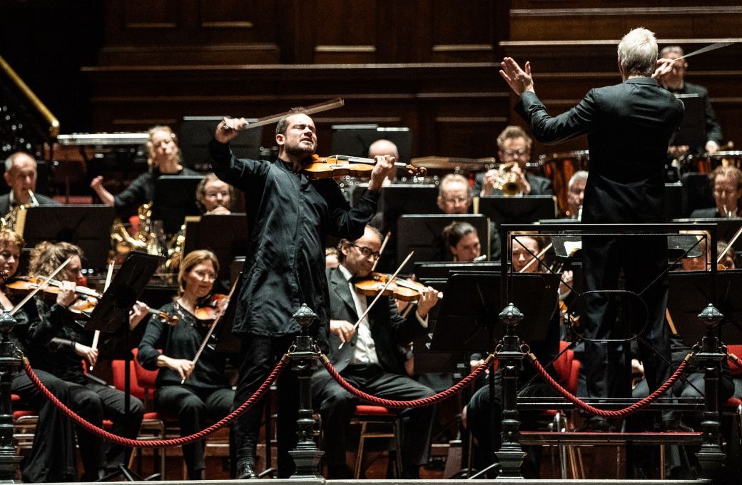 Marc Bouchkov, Hannu Lintu and the Netherlands Philharmonic Orchestra © Melle Meivogel