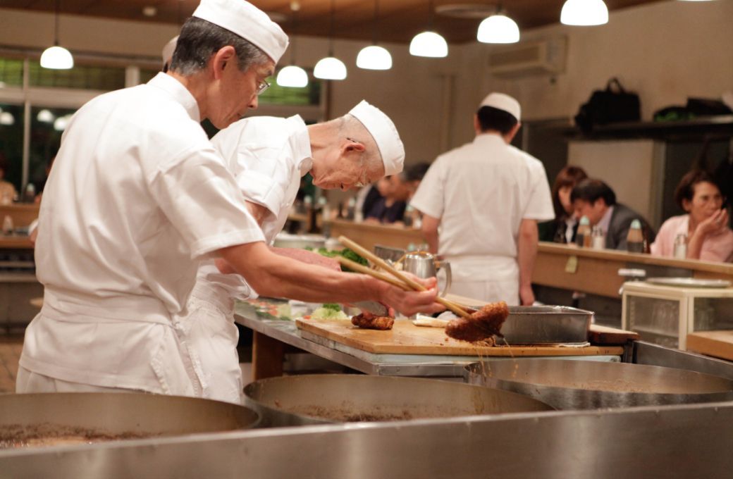 Chefs prepare <i>tonkatsu</i> &copy; Paul Keller | Flickr