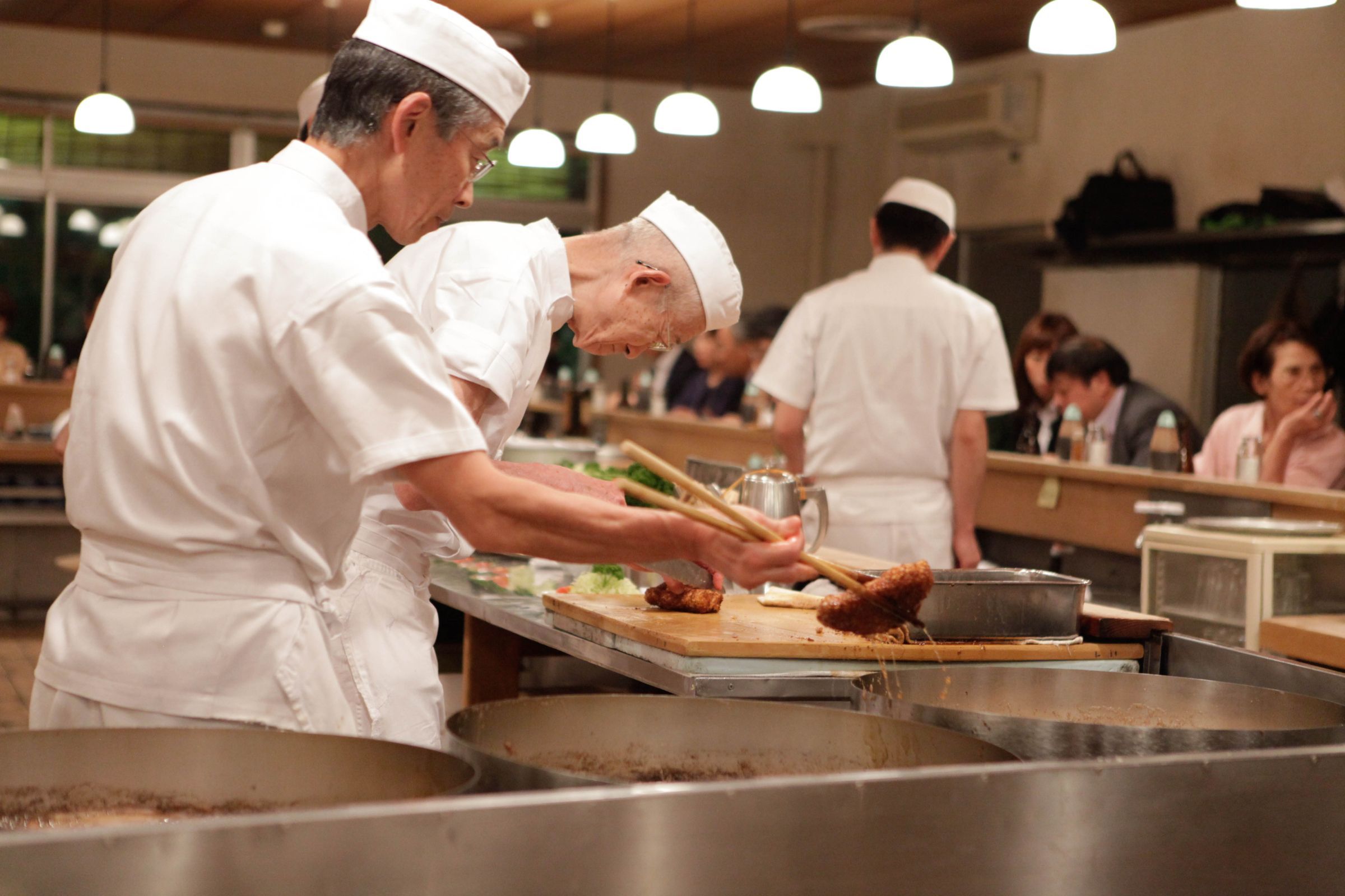Chefs prepare <i>tonkatsu</i> &copy; Paul Keller | Flickr