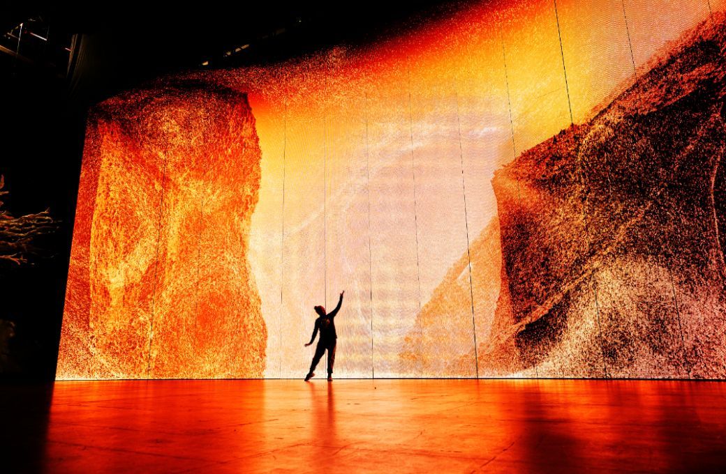 Storms of simulated particles dominate the vast LED screen &copy; Keith Saunders