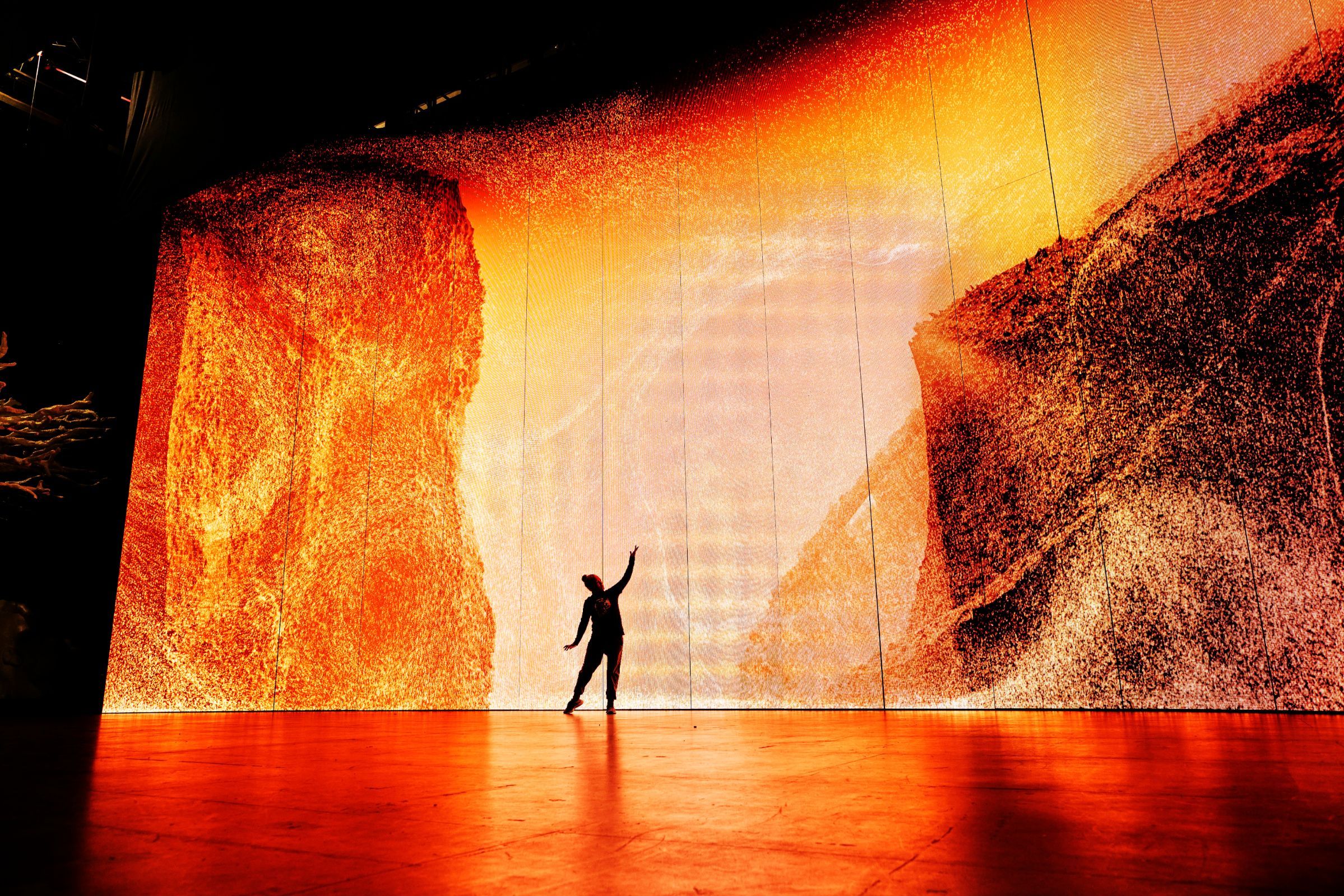 Storms of simulated particles dominate the vast LED screen &copy; Keith Saunders