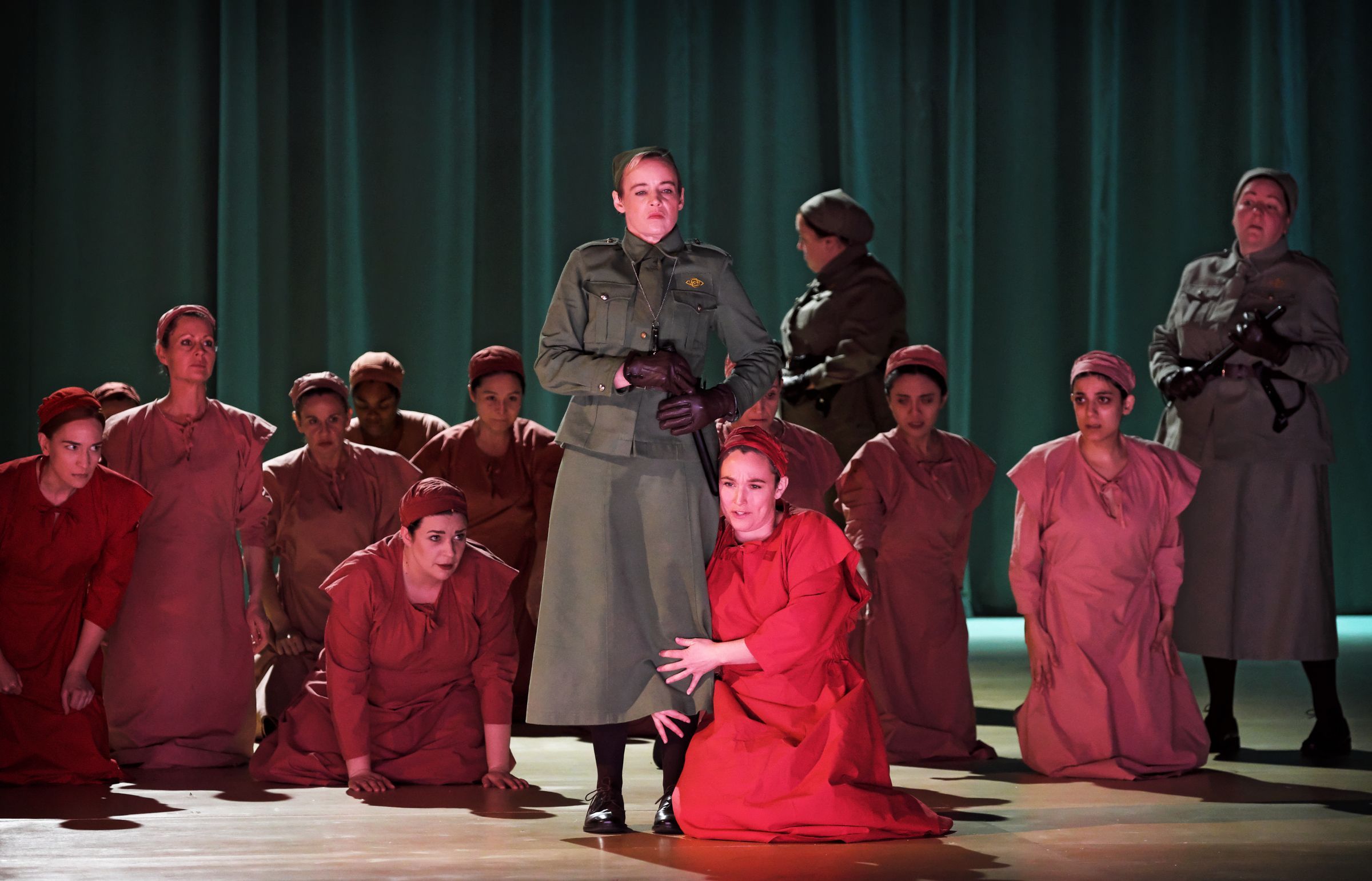 Rachel Nicholls (Aunt Lydia), Rhian Lois (Janine) and the ENO Chorus &copy; ENO | Zoe Martin