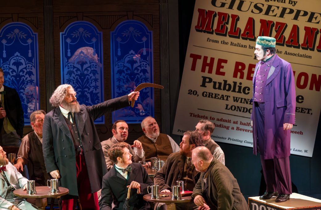 Roland Wood (Karl Marx), Paul Hopwood (Melanzane) and chorus &copy; James Glossop