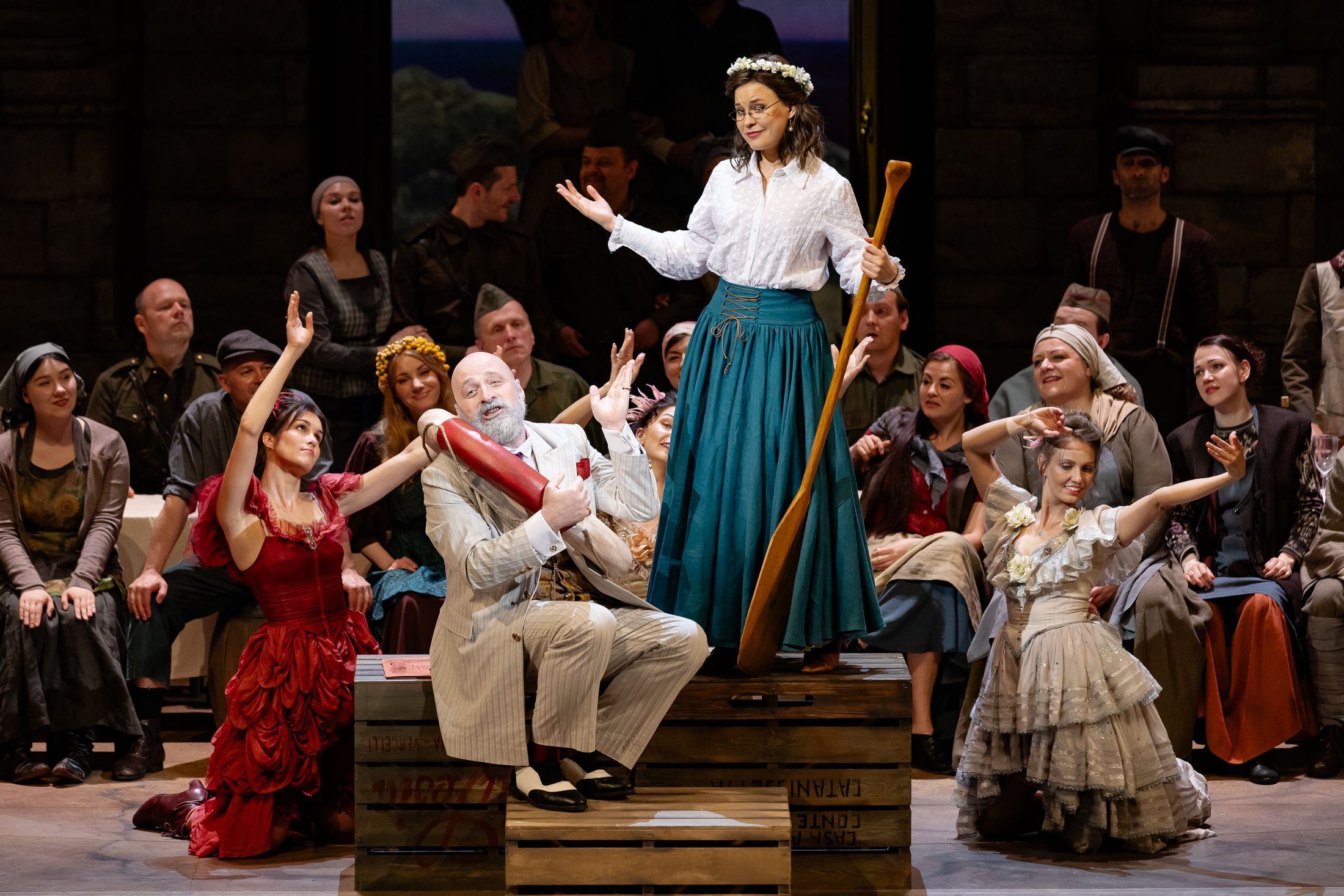 Peter Kálmán (Dulcamara), Lubov Karetnikova (Adina) and chorus &copy; Agnese Zeltiņa | Latvian National Opera
