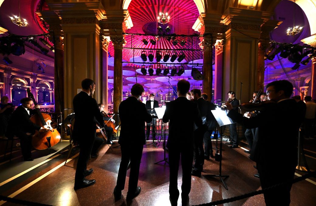 John Wilson and members of the Sinfonia of London in the Gallery &copy; BBC | Chris Christodoulou