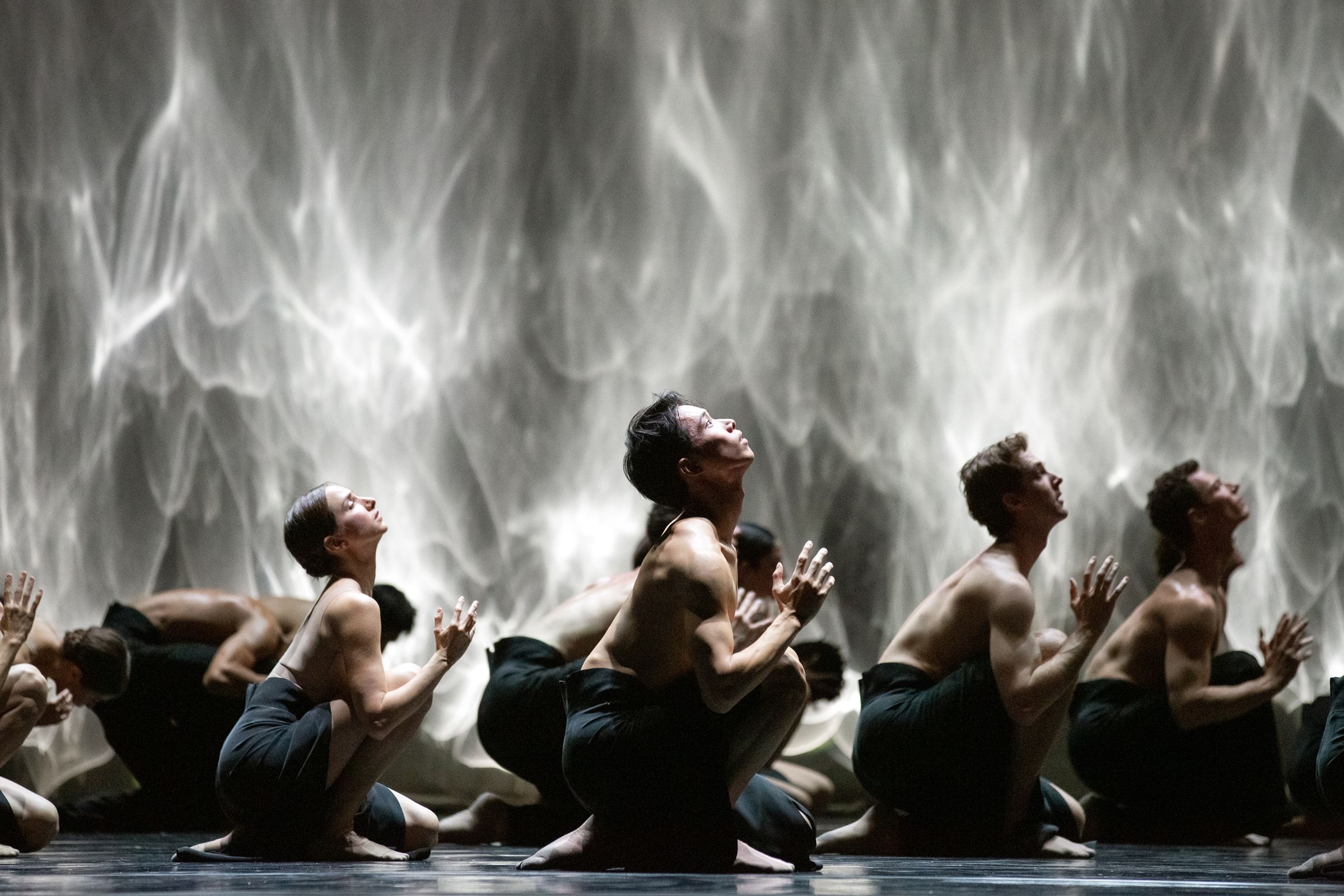 Kota Sato and Artists of the Ballet in Crystal Pite's <i>Angels' Atlas</i> © Karolina Kuras