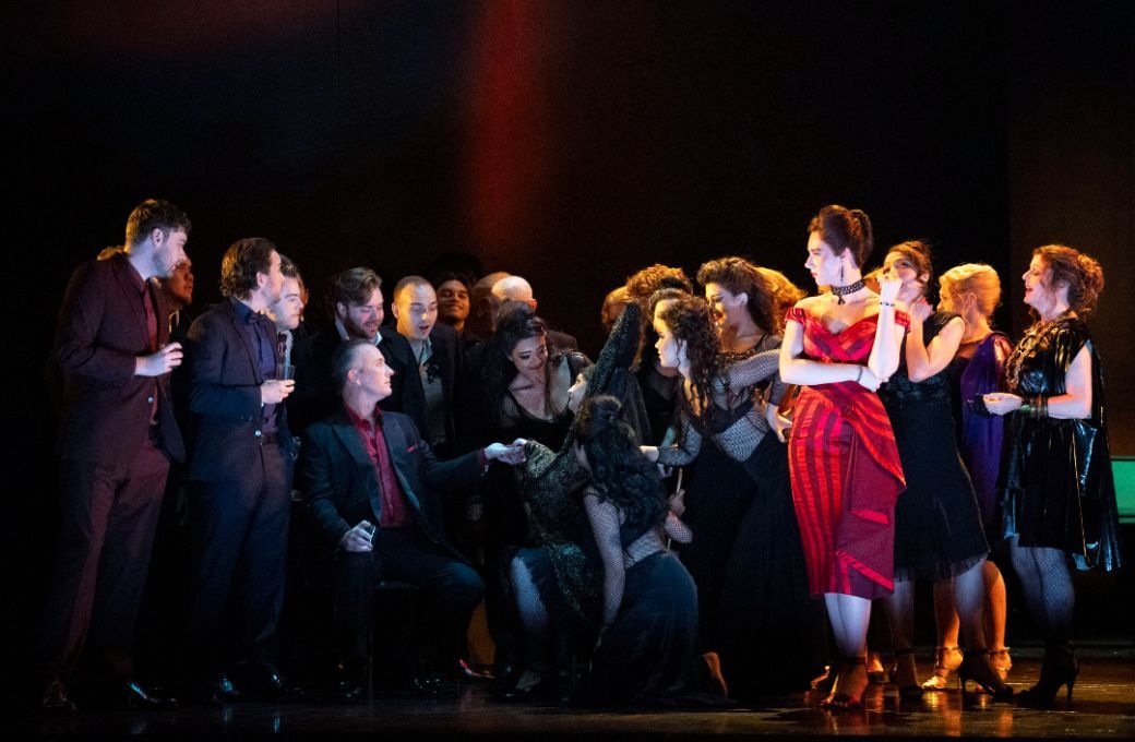 Esme Bronwen-Smith (Flora) with members of the Glyndebourne Chorus &copy; Glyndebourne Productions Ltd, Photographer: Richard Hubert Smith