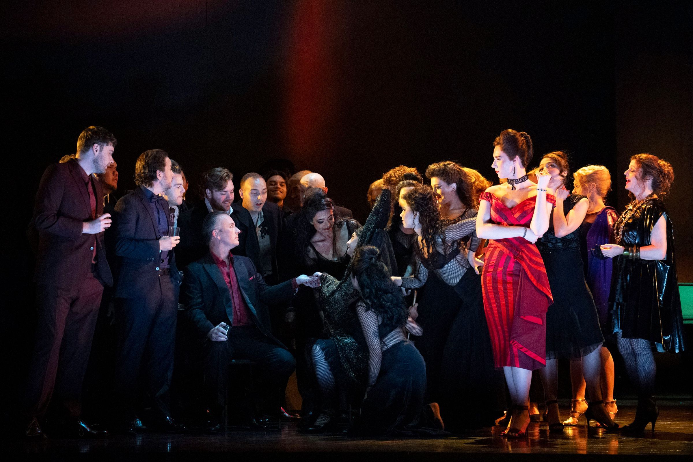 Esme Bronwen-Smith (Flora) with members of the Glyndebourne Chorus &copy; Glyndebourne Productions Ltd, Photographer: Richard Hubert Smith