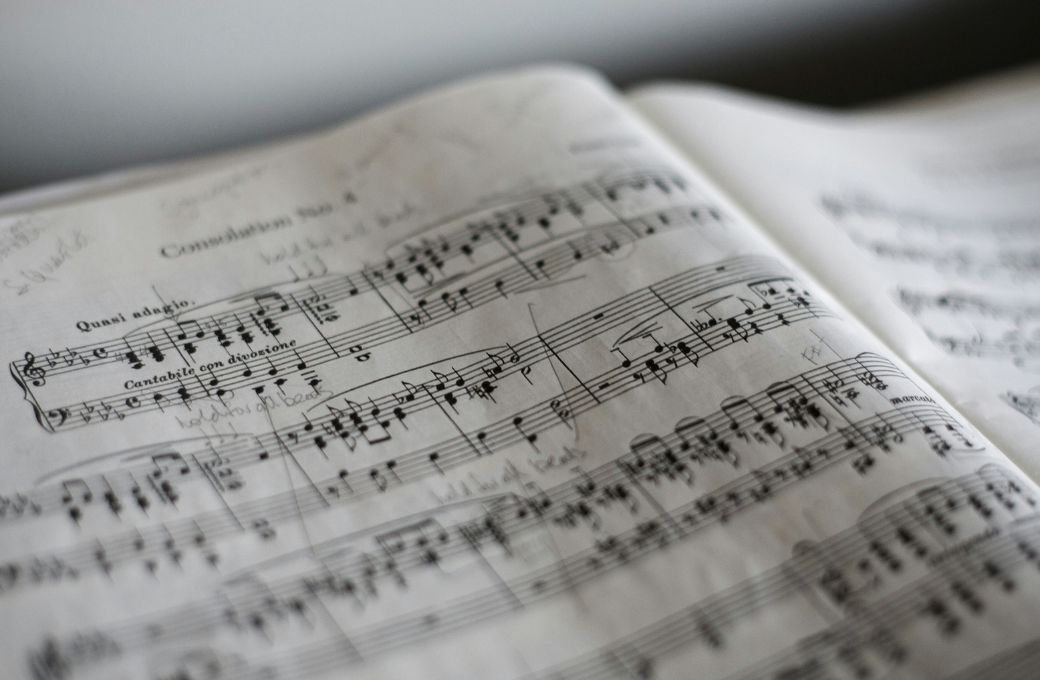 Musical score &copy; Photo by Marius Masalar on Unsplash