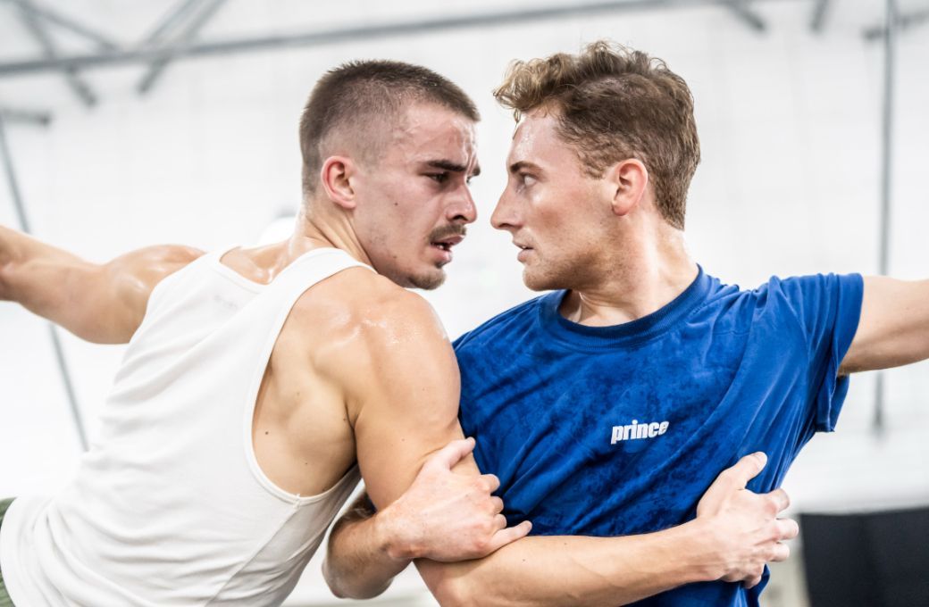 Harrison Dowzell, the Swan and James Lovell, the Prince rehearsing Bourne’s <i>Swan Lake</i> 2024