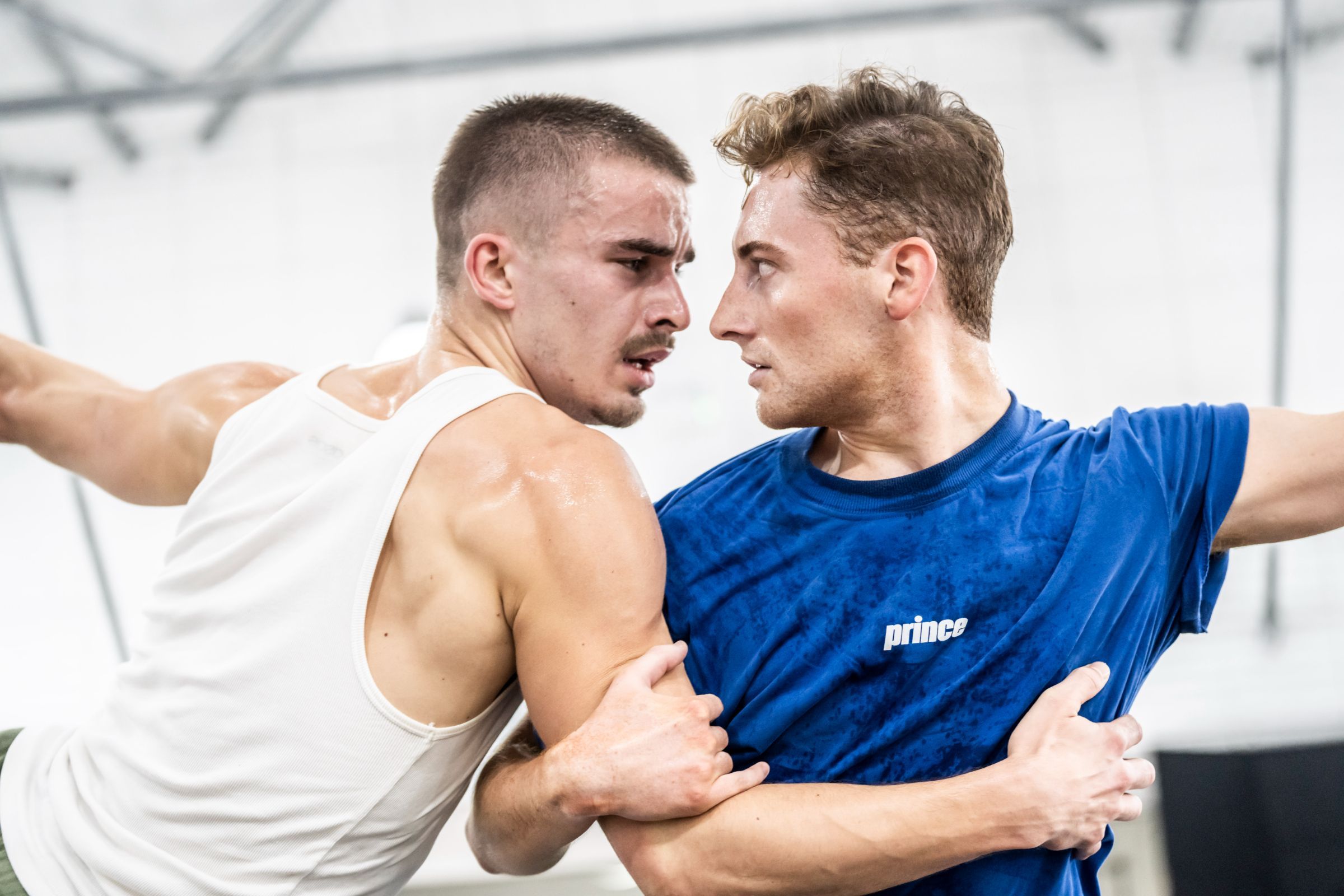 Harrison Dowzell, the Swan and James Lovell, the Prince rehearsing Bourne’s <i>Swan Lake</i> 2024