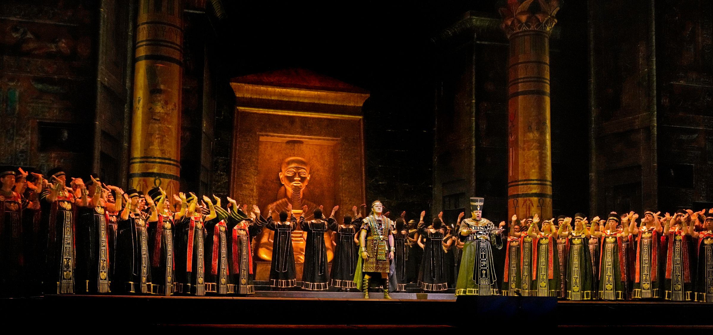 Piotr Beczała (Radamès), Dmitry Belosselskiy (Ramfis) and Met Chorus &copy; Ken Howard | Met Opera