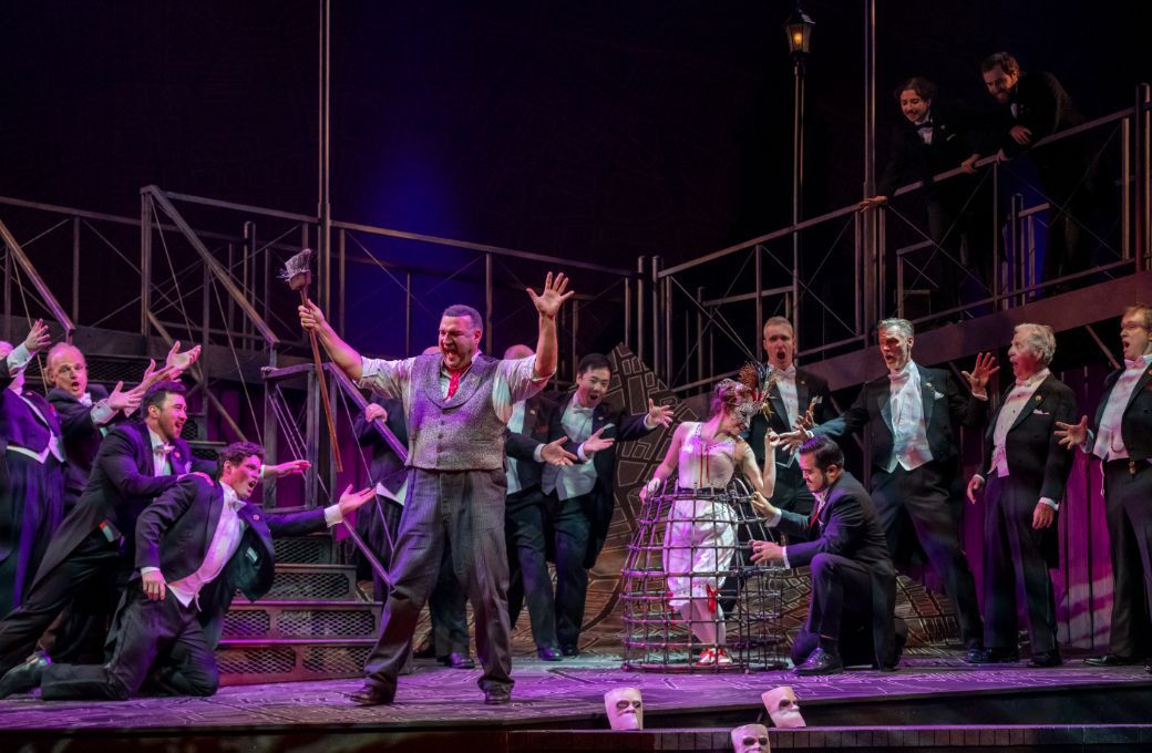 Michael Chioldi (Rigoletto) and ensemble &copy; Emily Cooper