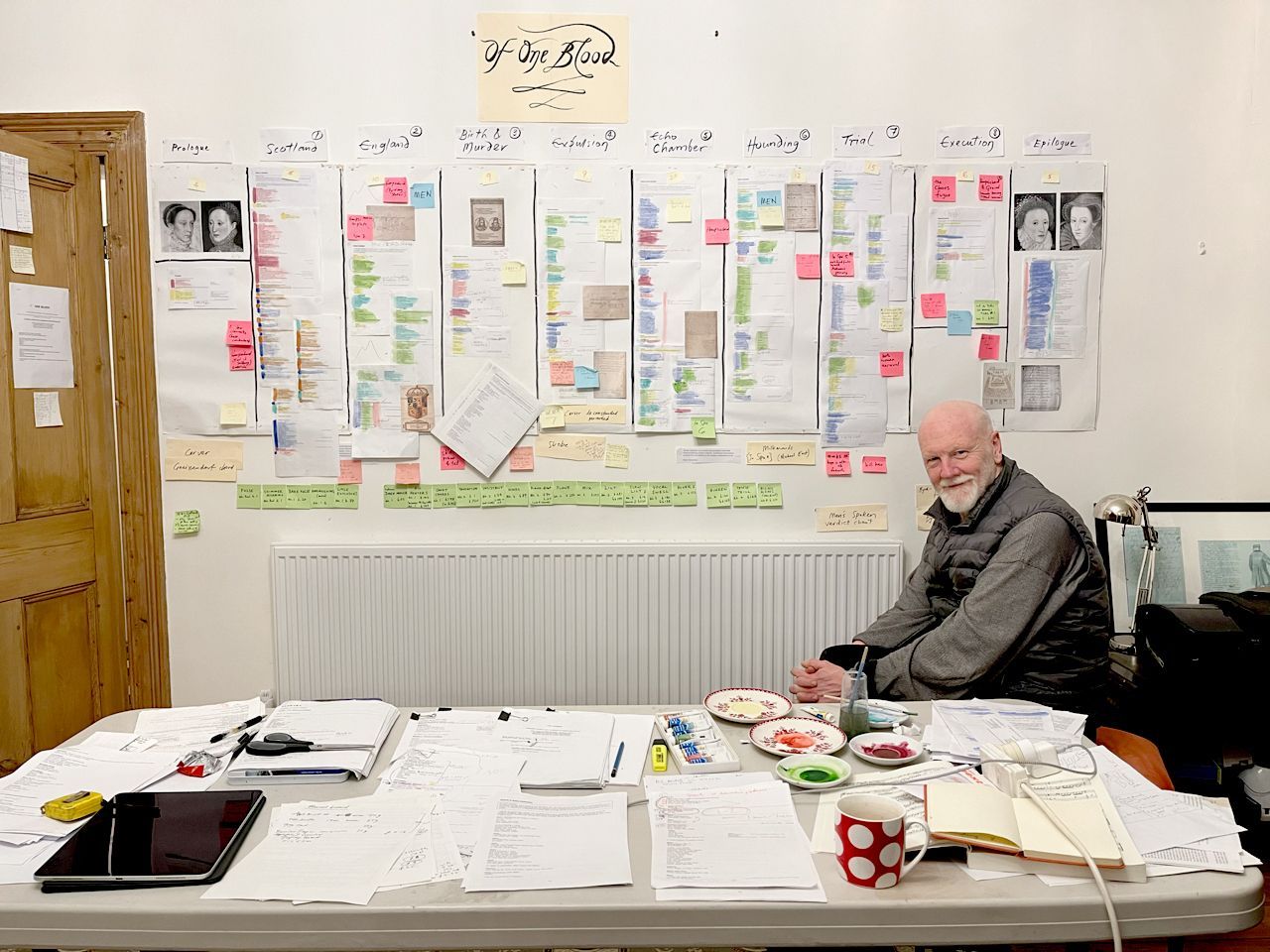 Brett Dean sits by the wall plan for <i>Of One Blood</i> &copy; Heather Betts