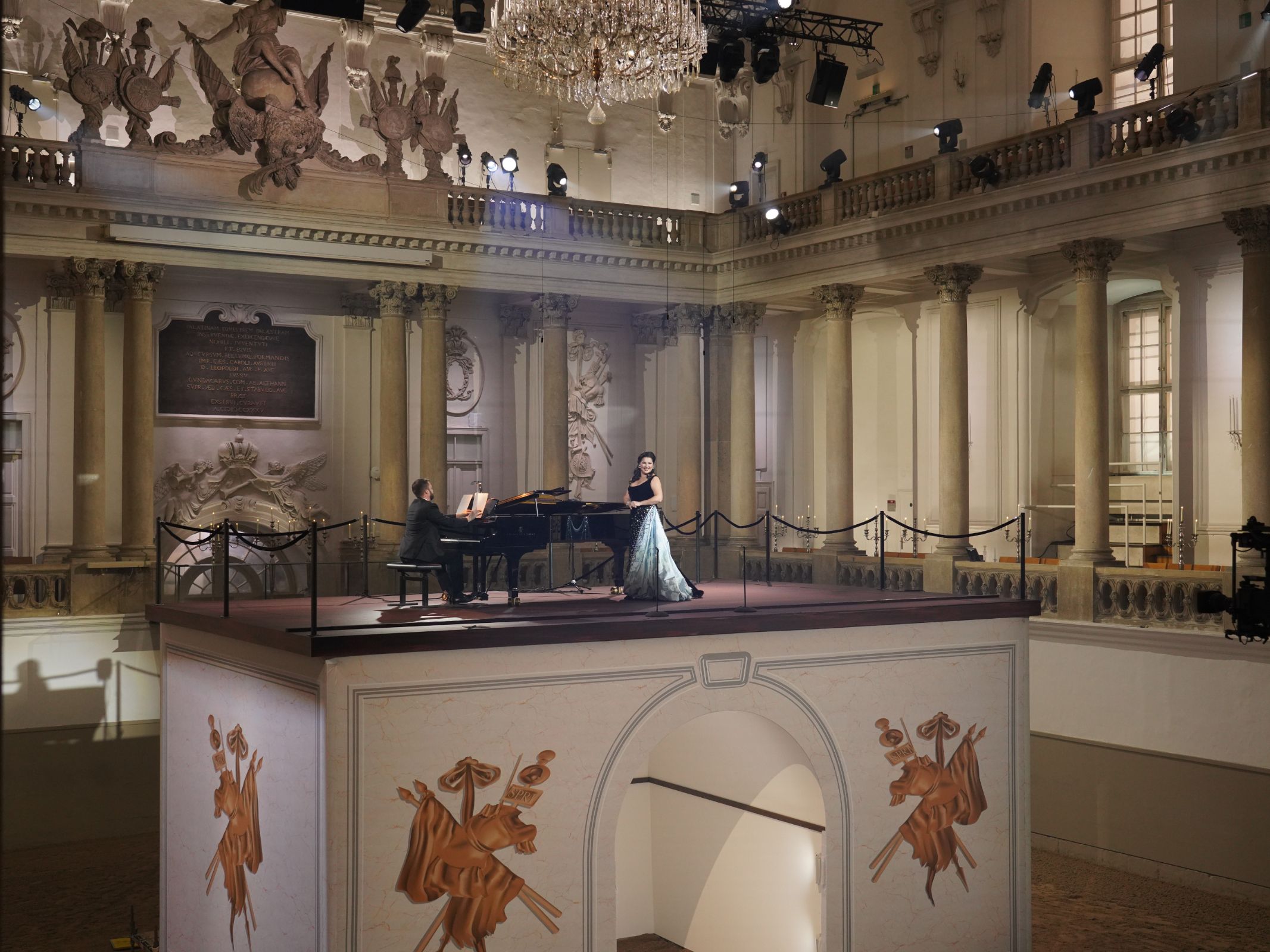 Pavel Nebolsin and Anna Netrebko in the Spanish Riding School, Vienna &copy; Jürgen Hausmann | Met Opera