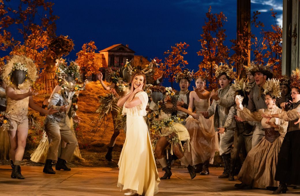 Olga Kulchynska (Tatyana) and members of the Santa Fe Opera Chorus &copy; Bronwen Sharp for Santa Fe Opera