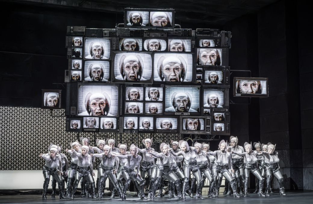 Otto Pichler (on screen) and Flower Maidens &copy; The Royal Opera | Marc Brenner