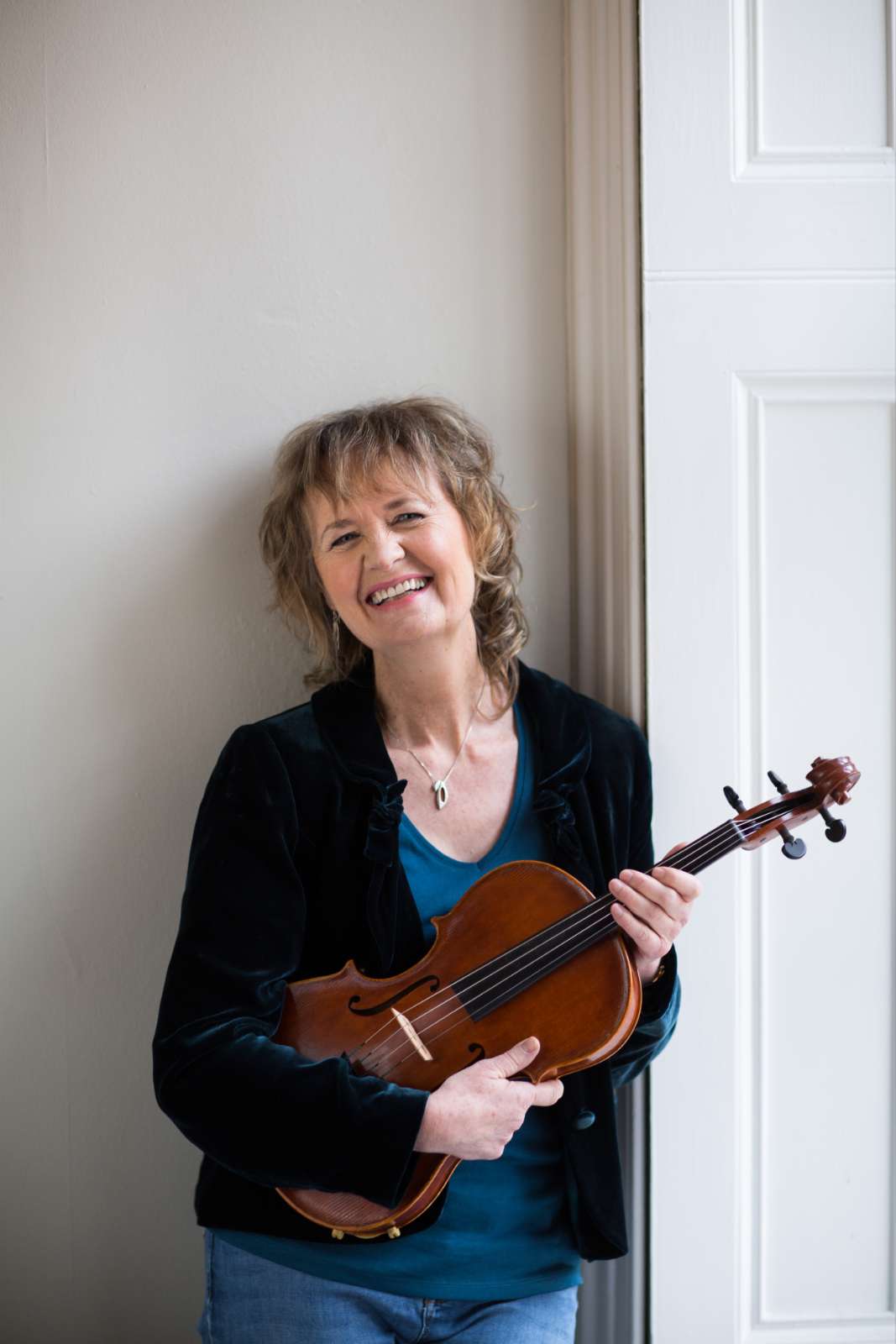 Sally Beamish with the viola made by her daughter © Ashley Coombes