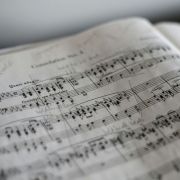 Musical score &copy; Photo by Marius Masalar on Unsplash